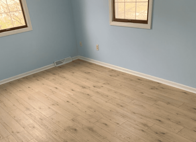 A room with wood floors and blue walls.